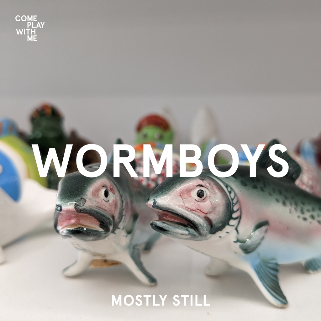 Cover image for the wormboys single "mostly still". The cover image features two porcelain fish, who both wear shocked expressions.