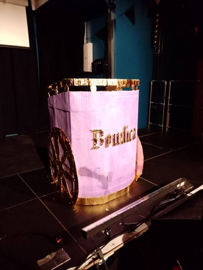 Photograph of a home-made DJ booth designed to look like an ancient Celtic chariot, with the name Boudica embossed on the front. 